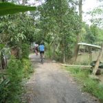 view of path and wife on her bike