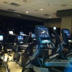 view of about a dozen cardio machines